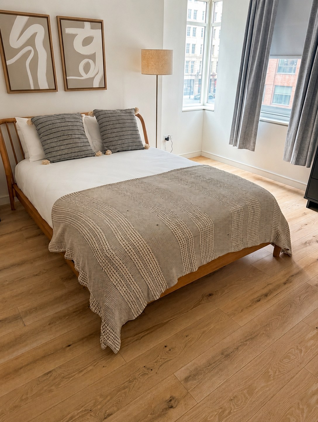 Clean finished bedroom with bright walls and hardwood floor — Westchester NY interior painting